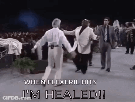 Group Of Men Holding Hands And Dancing On Stage GIF