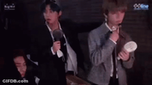 Group Of Men Holding Microphones With Fan GIF