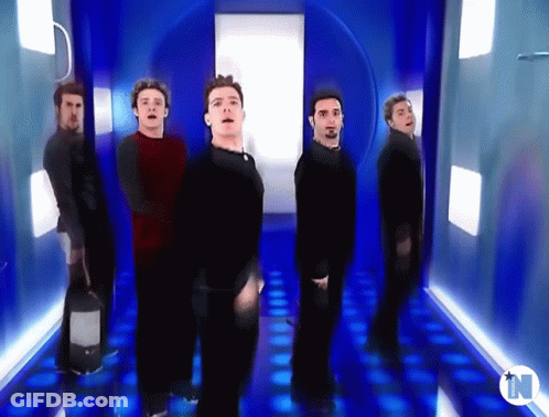 Group Of Men In Blue Hallway With Letter N GIF