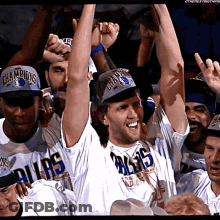 Group Of Men In Dallas Shirts And Hats Raising Arms GIF