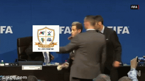 Group Of Men In Front Of Blue Wall Saying FIFA GIF