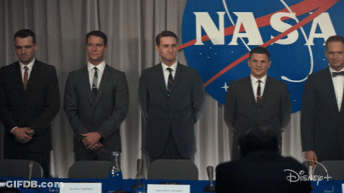 Group Of Men In Front Of NASA Logo GIF
