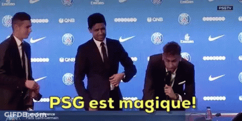 Group Of Men In Front Of PSG Est Magique Wall GIF