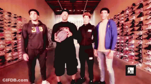 Group Of Men In Front Of Shoe Wall Saying Com Plex GIF