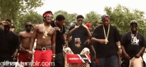 Group Of Men In Front Of Trinidad Record Cart GIF