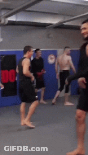 Group Of Men In Gym With Sign Saying 100 GIF