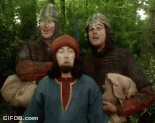 Group Of Men In Helmets Standing In Forest GIF