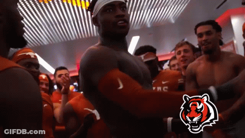 Group Of Men In Locker Room With Tiger Logo GIF