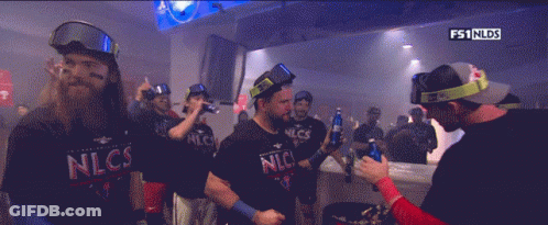 Group Of Men In Nlcs Shirts Dark Room GIF