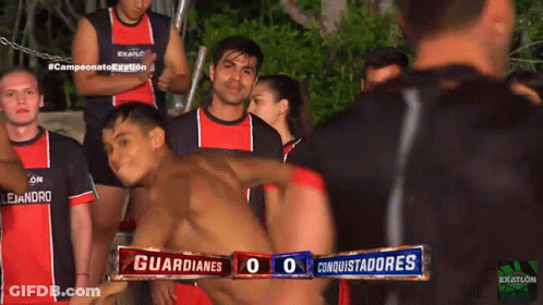 Group Of Men In Red And Black Exatlon Shirts GIF