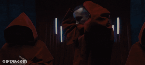 Group Of Men In Red Hooded Cloaks GIF