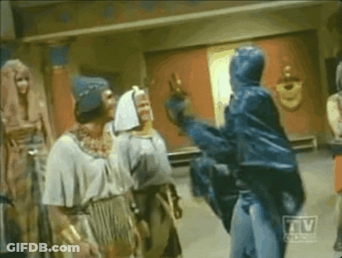 Group Of Men In Room With TV Logo GIF