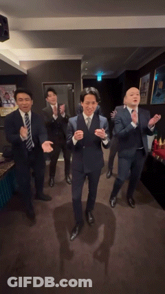 Group Of Men In Suits Dancing GIF