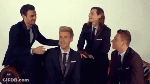 Group Of Men In Suits Sitting On Couch GIF