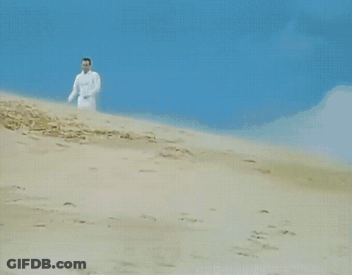 Group Of Men In White Walking Down Hill GIF