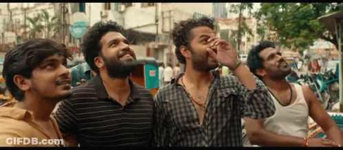 Group Of Men Looking Up At Sky On Street GIF