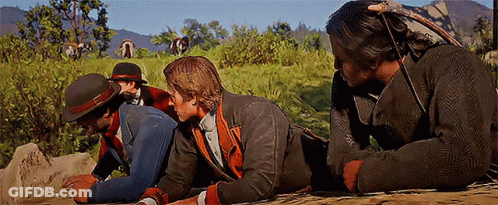 Group Of Men Lying In Field Talking GIF