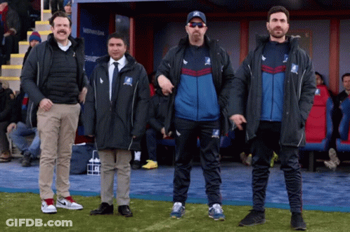 Group Of Men On Field With T-Shirt Letter T GIF