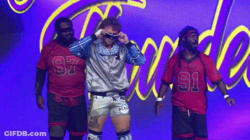 Group Of Men On Stage With Purple Background GIF