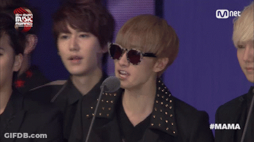 Group Of Men On Stage With Woman And Mama Text GIF