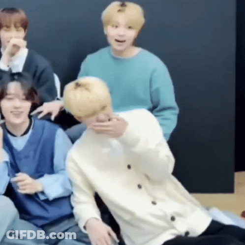 Group Of Men One Holding Another In Arms GIF