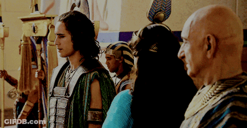 Group Of Men One With Feathered Headpiece GIF