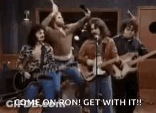 Group Of Men Playing Guitars And Singing In A Band GIF
