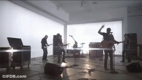Group Of Men Playing Instruments GIF