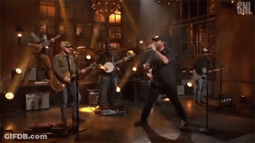 Group Of Men Playing Instruments On SNL Stage GIF