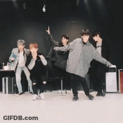 Group Of Men Posing In Dark Room GIF