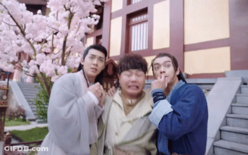 Group Of Men Posing In Front Of Building GIF