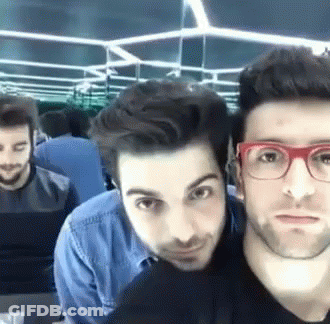 Group Of Men Posing One Wearing Glasses GIF