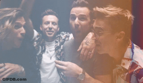 Group Of Men Posing One With Watch GIF
