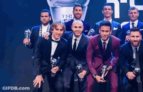 Group Of Men Posing With Trophies In Front Of FIFA Trophy GIF