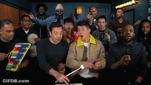 Group Of Men Singing And Playing Xylophone GIF