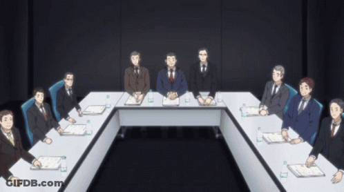 Group Of Men Sitting Around Long Table GIF