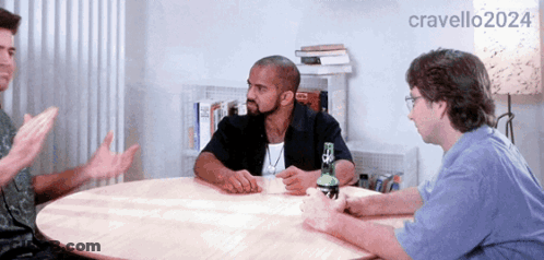 Group Of Men Sitting Around Table 2024 GIF