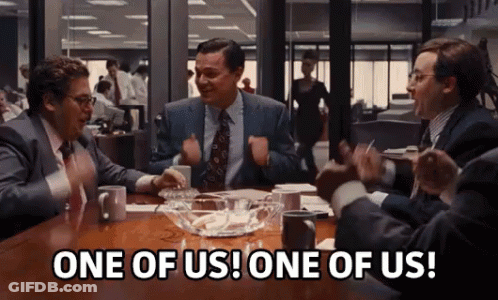Group Of Men Sitting Around Table GIF