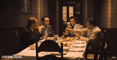 Group Of Men Sitting Around Table Movieclips.com GIF