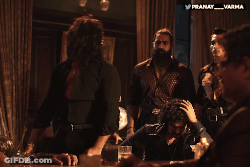 Group Of Men Sitting Around Table With Pranay Varma Watermark GIF