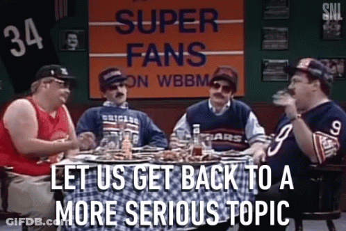Group Of Men Sitting Around Table With Super Fans Sign GIF