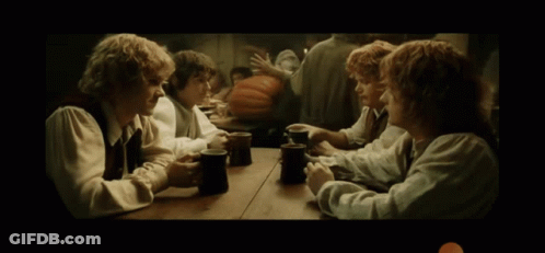 Group Of Men Sitting At Table With Mugs GIF