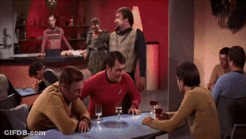 Group Of Men Sitting At Table With Wine Glasses GIF