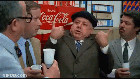 Group Of Men Sitting By Coca Cola Ad GIF