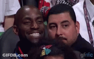 Group Of Men Sitting In Stadium One Smiling GIF