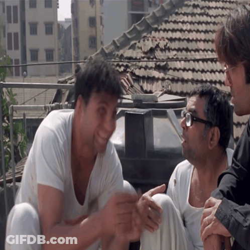 Group Of Men Sitting On Roof Talking GIF