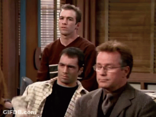 Group Of Men Sitting One With Glasses GIF