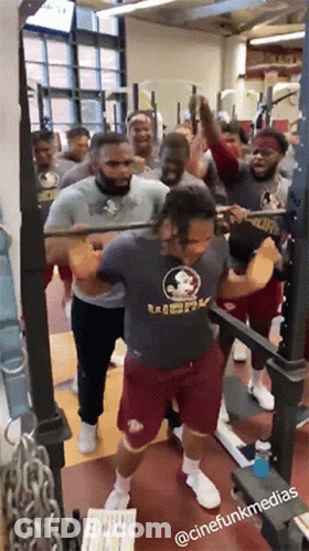 Group Of Men Squatting In Gym With Florida State Shirt GIF