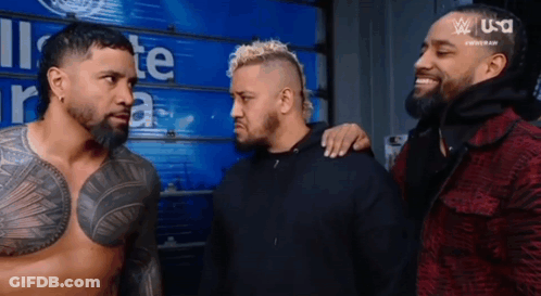 Group Of Men Standing By Blue Wall GIF