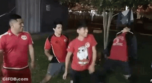 Group Of Men Standing In A Park GIF